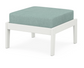 A light blue cushioned deep seating ottoman with a vintage white frame, made from all-weather materials suitable for outdoor use.