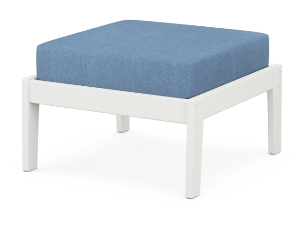 A blue cushioned deep seating ottoman with a vintage white frame, made from all-weather materials suitable for outdoor use.