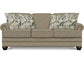 Beige sofa with floral-patterned cushions on a white background