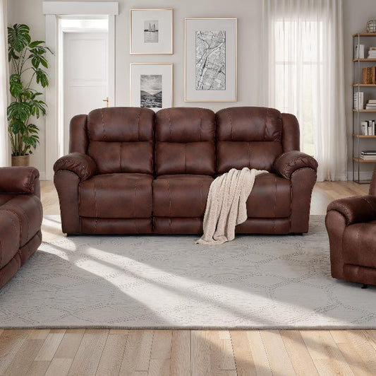 Brown leather sofa set in a living room with decor elements.