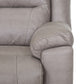 Close-up of a gray sofa with visible stitching on a white background