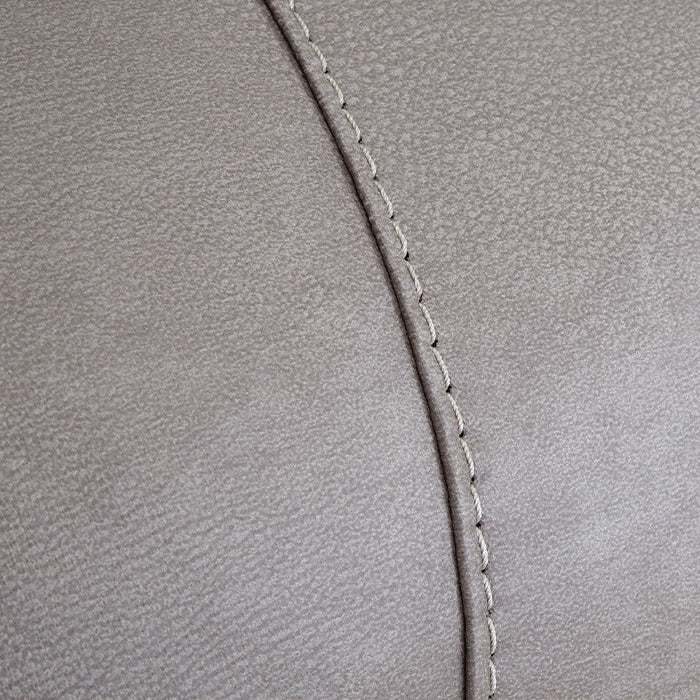 Close-up of gray leather with a visible seam