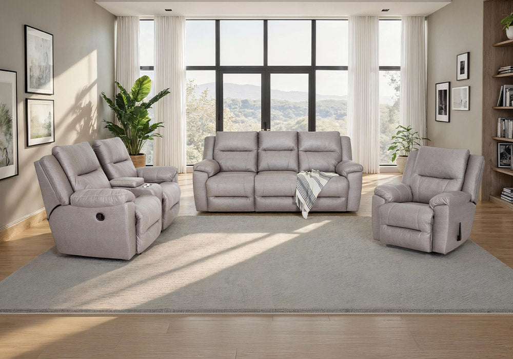 Gray sofa set in a living room with large windows and decor.