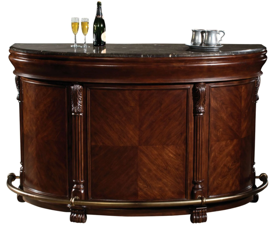 An elegant, traditional-style bar with a marble top surface, wooden body in a distressed cherry finish, and metal accents, equipped with wine storage racks and a footrest.