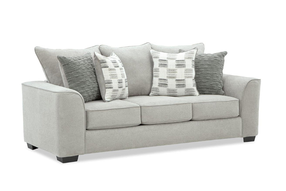 Gray sofa with patterned cushions on a white background
