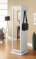 White standing mirror with coat hooks in a room setting