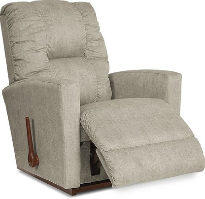 A beige power recliner with a chaise seat and legrest, showing the chair in a reclined position.