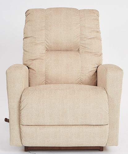 A cream power recliner with a chaise seat and legrest, showing the chair in a reclined position.