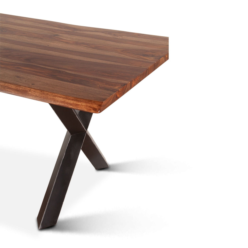 Wooden table with X-shaped metal legs on a white background