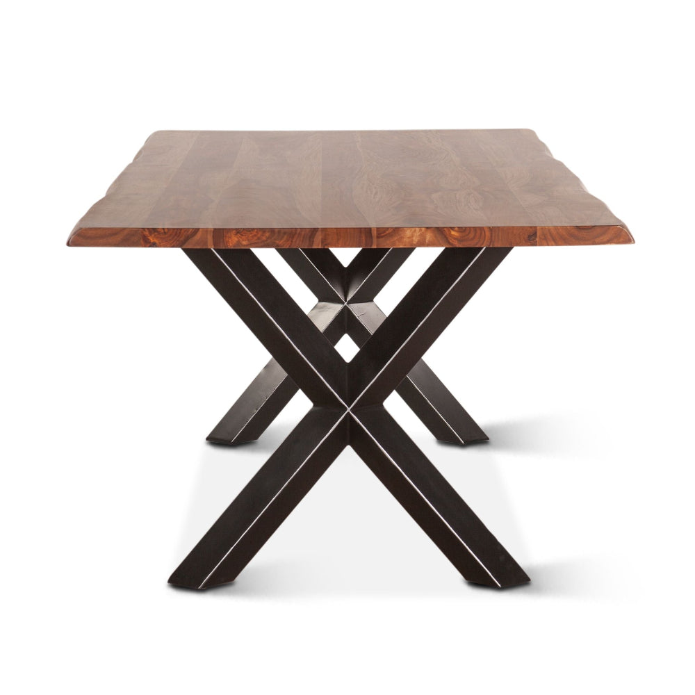 Wooden table with a unique metal base on a white background