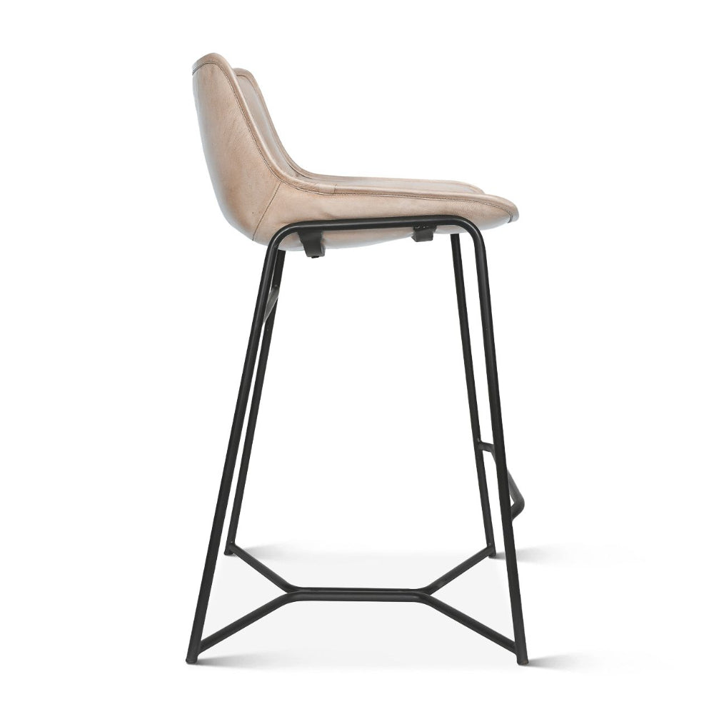 Bar stool with beige seat and black metal frame on a white background