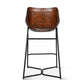 Brown leather bar stool with black metal legs on a white background