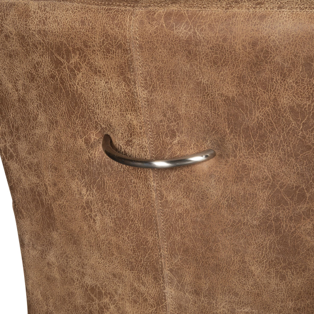 Close-up of a brown leather surface with a metal handle.
