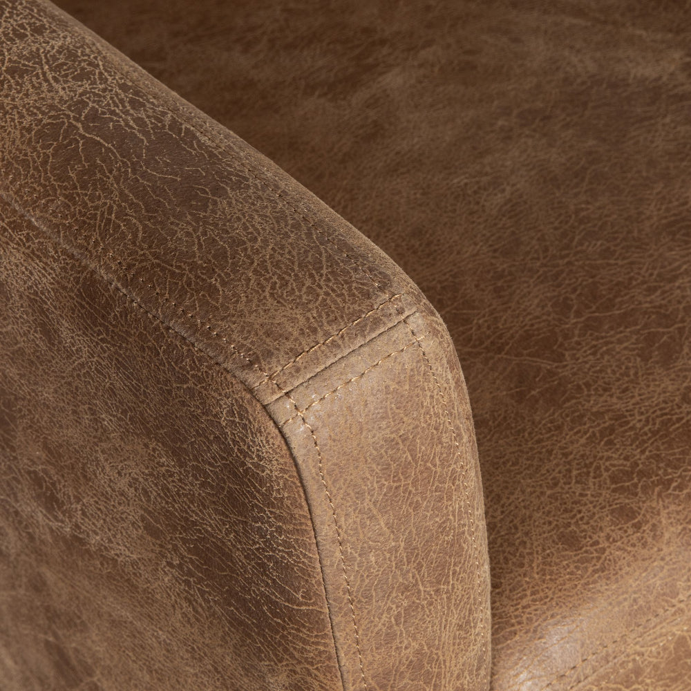 Close-up of brown leather surface with stitching detail