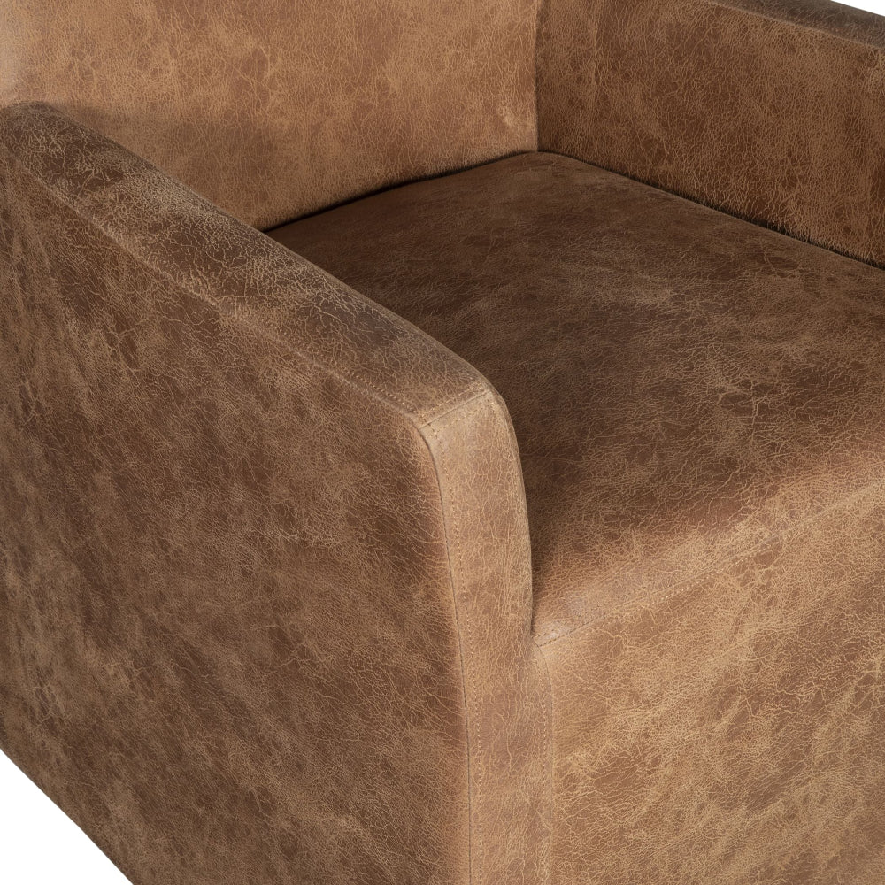 Close-up of a brown leather sofa corner