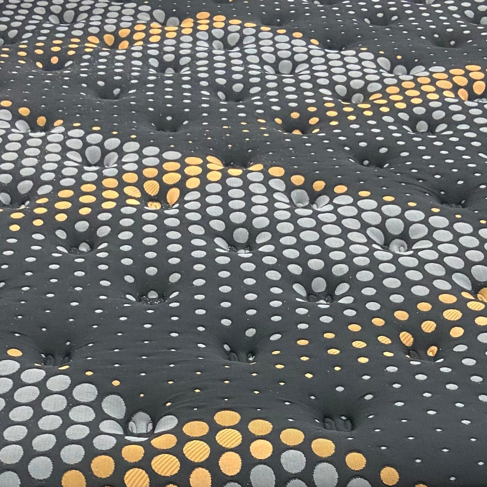 Close-up of a textured wall panel with circular patterns 