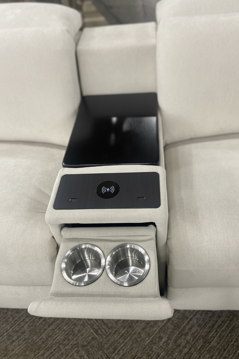 Intricate armrest with cup holders and control panel on a beige sectional