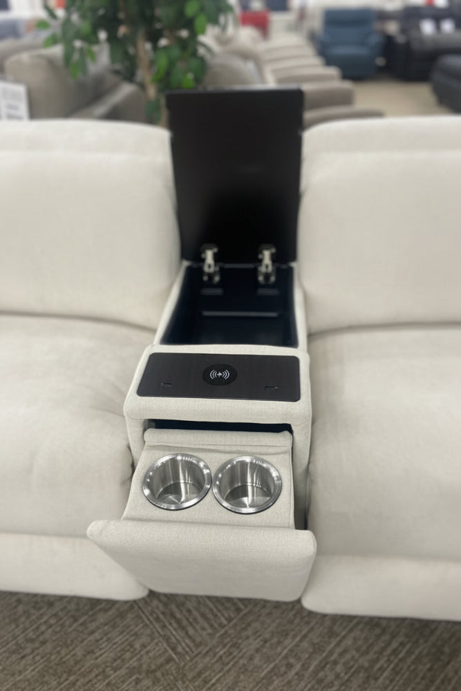 Intricate armrest with cup holders and control panel on a beige sectional