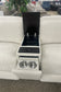 Intricate armrest with cup holders and control panel on a beige sectional