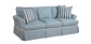 Light blue sofa with striped cushions on a white background