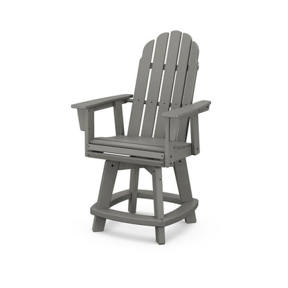 A gray Adirondack-style counter and swivel chair with  arms designed for outdoor use.