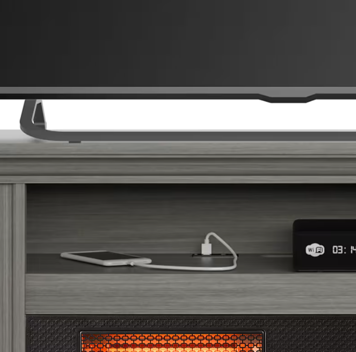 Electronic device with a USB cable plugged into it on a wooden surface.