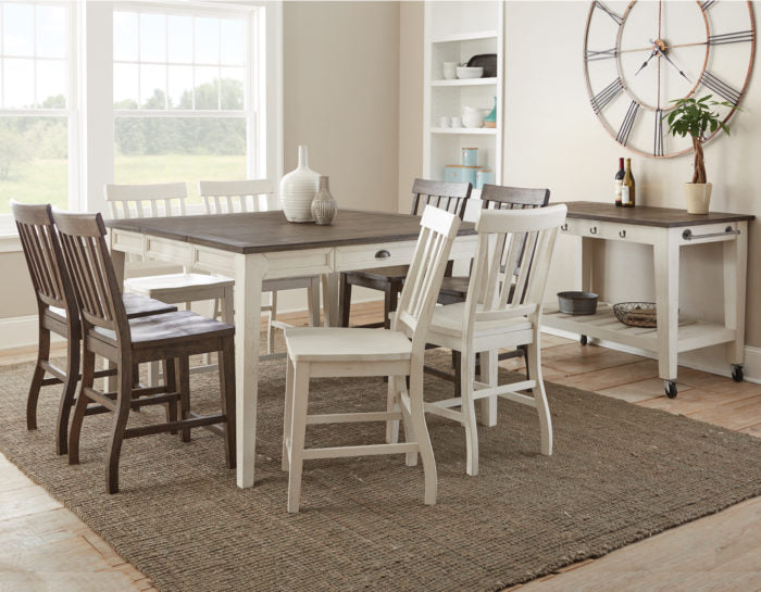 A counter dining set with a two-tone finish featuring antiqued white and dark oak colors, including a rectangular table and four chairs with a modern farmhouse design.