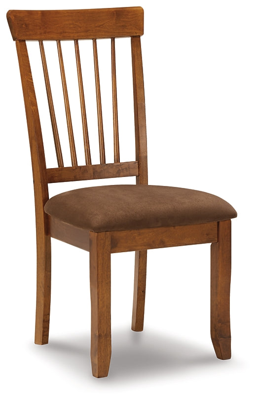 Wooden chair with a brown cushioned seat on a white background