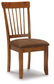 Wooden chair with a brown cushioned seat on a white background