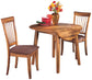 Wooden dining table with two chairs and a vase of flowers on a white background