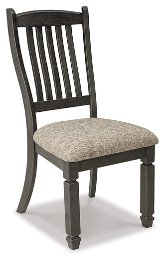 Wooden chair with a patterned cushion on a white background