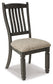 Wooden chair with a patterned cushion on a white background