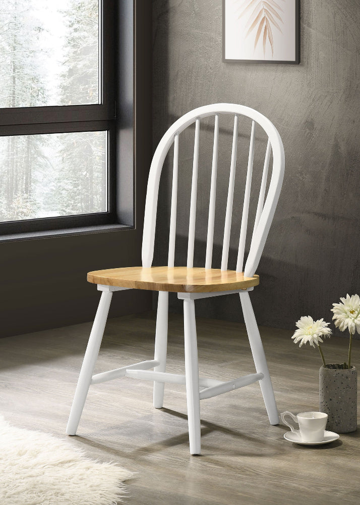 White chair with wooden seat in a room with a window and decorative elements.