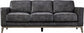 Gray sofa with wooden legs on a plain background