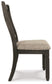 Dining chair with dark wood frame and beige cushion on a white background