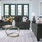 Living room with gray sofa,loveseat, coffee table, and decorative pillows.