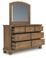 Feddinger Queen Storage Sleigh Bed with Mirrored Dresser