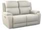Beige recliner loveseat on a white background