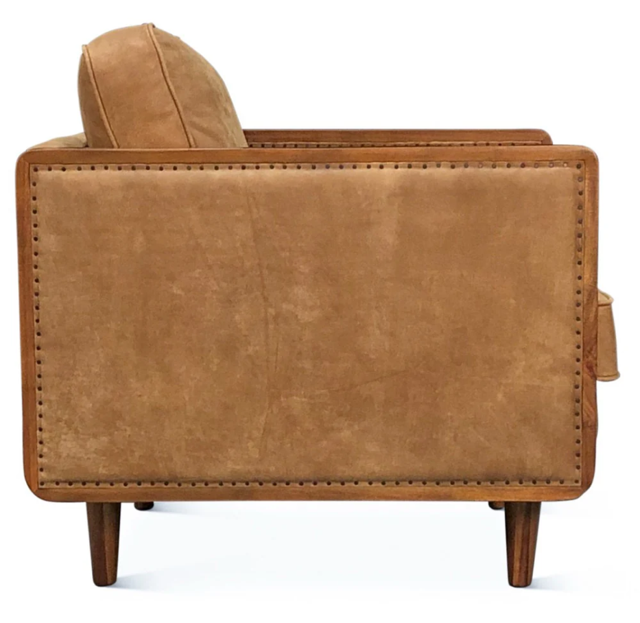 Brown leather armchair on a white background