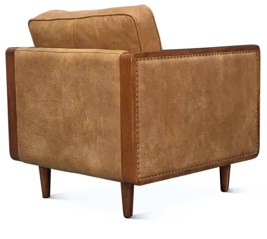 Brown leather armchair on a white background
