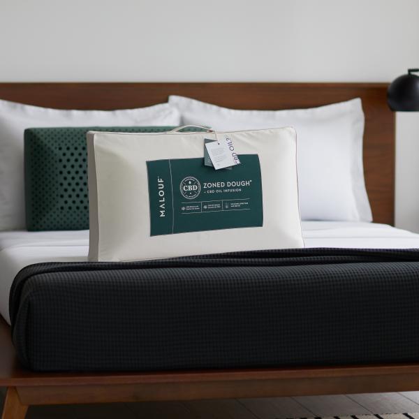 CBD Zoned Dough pillow with a natural cotton cover and a label indicating it is infused with CBD oil.